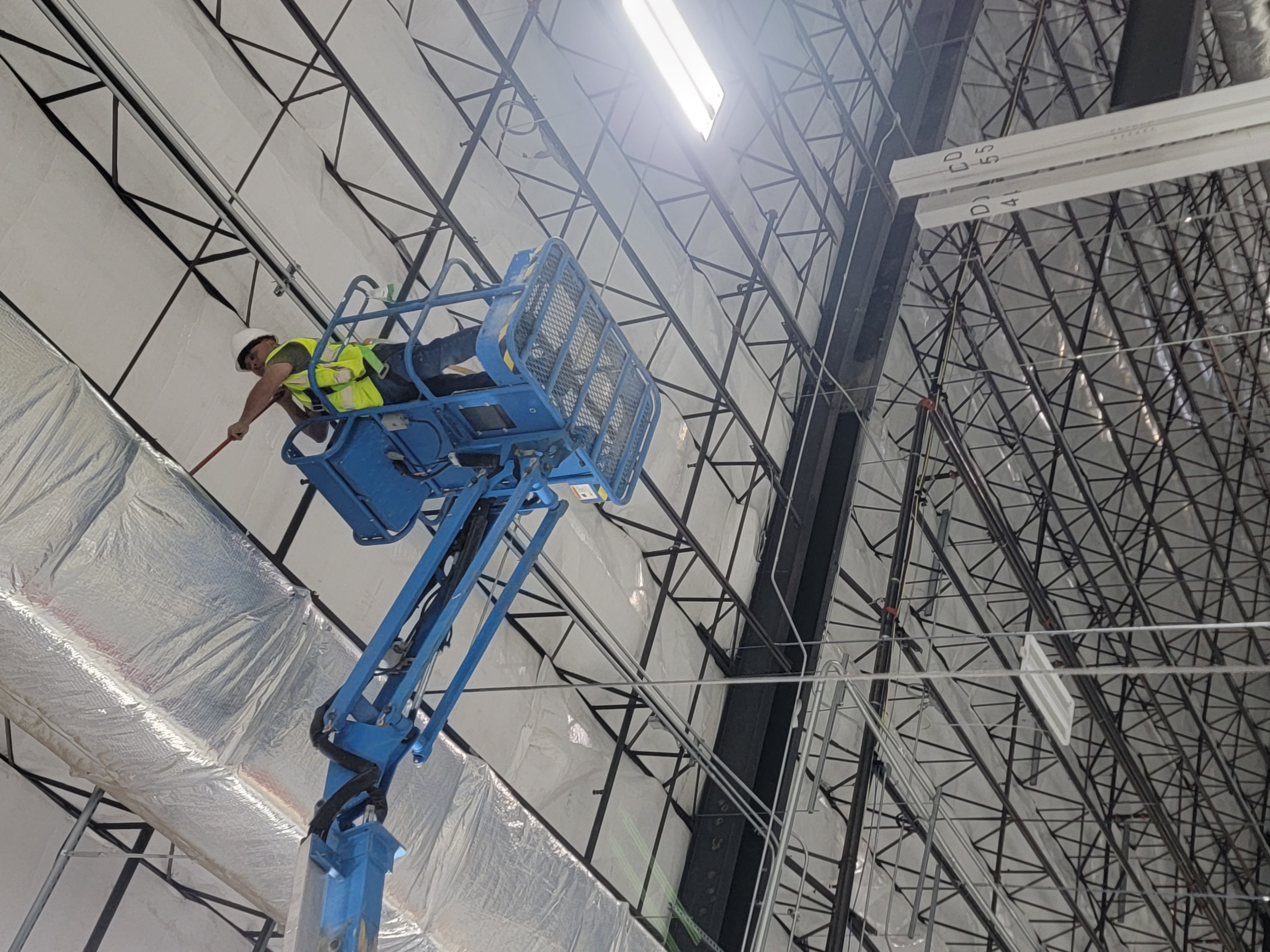 VBCO team working at height inside industrial fulfillment facility